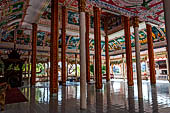 Vientiane, Laos - Pha That Luang, among the Other structures on the ground there is an open sala decorated with brightly colored paintings.  